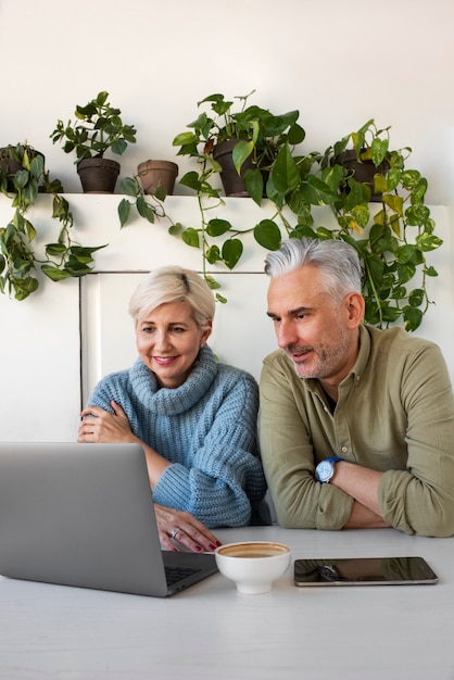 Free photo old couple learning to use technology