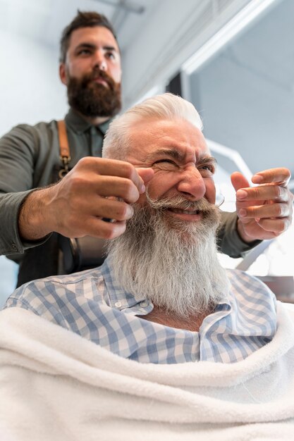 Old customer making face at hair salon