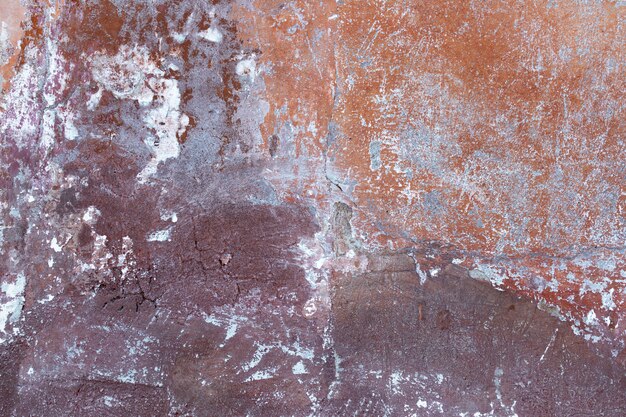 古い損傷した壁のテクスチャの色が混在