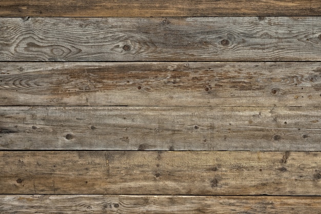 Free photo old faded dull pine natural dark wooden background