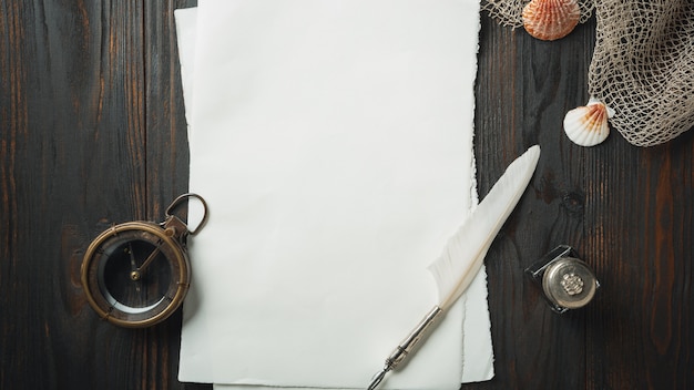 Old fashioned flat lay with letters writing accessories on dark wooden table