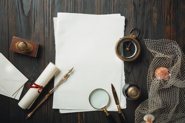 Free photo old fashioned flat lay with letters writing accessories on dark wooden table