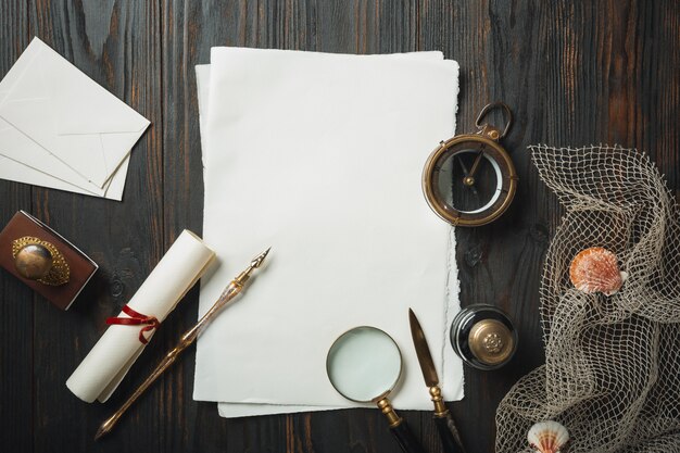 Old fashioned flat lay with letters writing accessories on dark wooden table