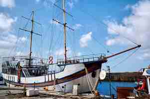 Free photo old fishing boat in a port in the evening