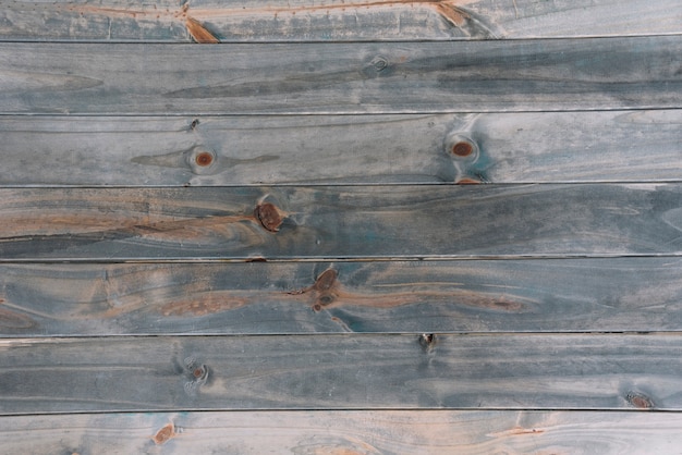An old grey colored textured wooden plank