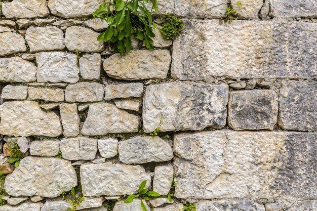 Old grungy gray stone wall texture