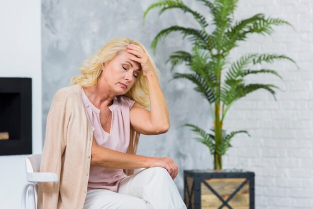 Free photo old lady having a headache