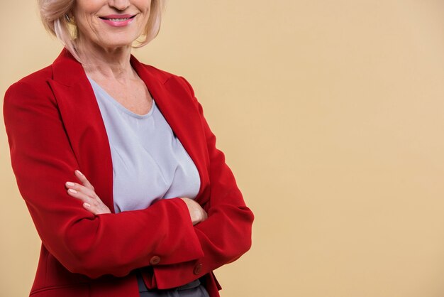 Free photo old lady posing with her arms crossed