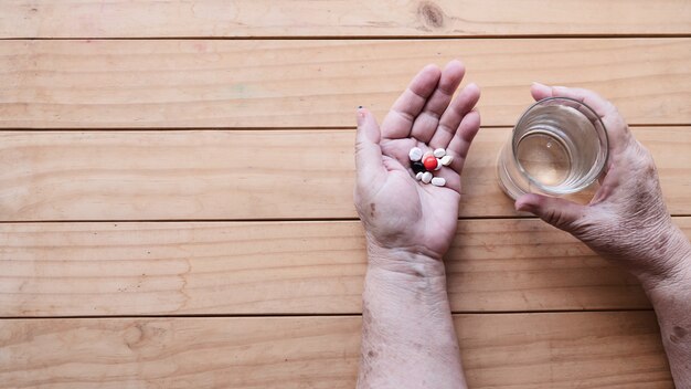 Old lady prepare to eat daily medicine pill 