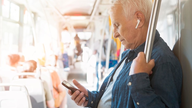 Old man in public transportation concept