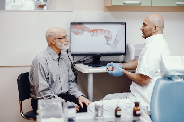 Old man sitting in the dentist's office