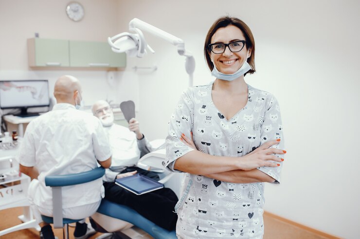 Free Photo old man sitting in a dentistry room