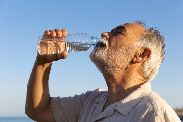 Old man struggling with high temperature