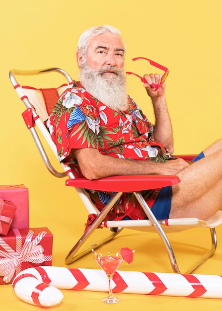 Old man with sunbed and candy cane