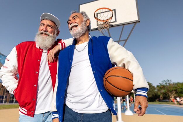 Old men wearing varsity jacket outdoors