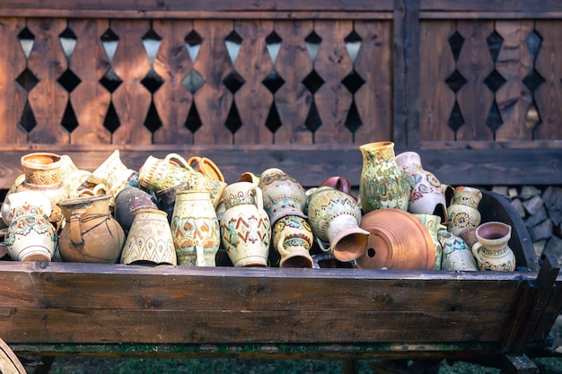 Old painted earthenware jugs in the village