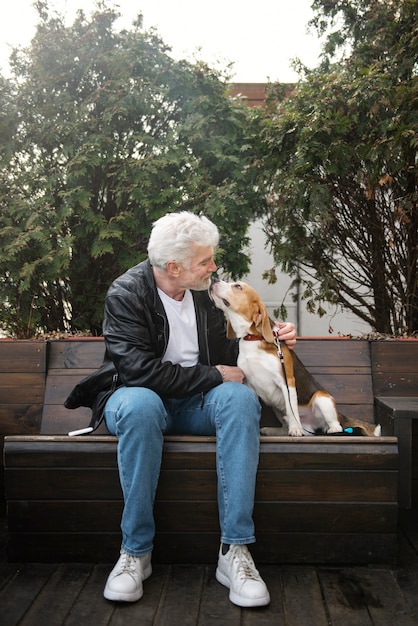 Free photo old person with their pet dog