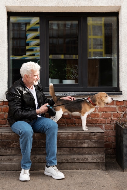 Free photo old person with their pet dog