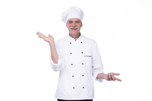 Old professional chef cook isolated on white wall, holding hand