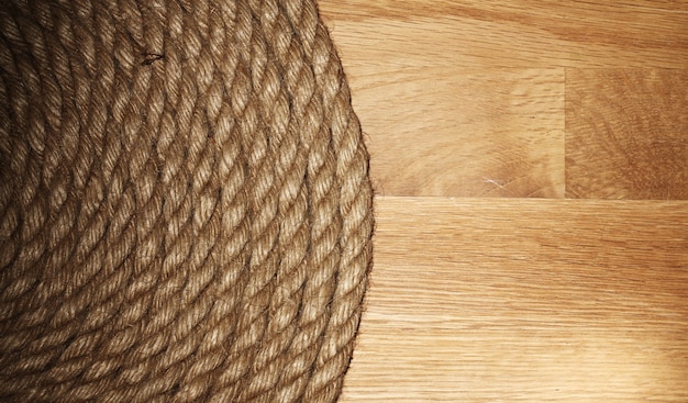 Free photo old rope over wooden surface