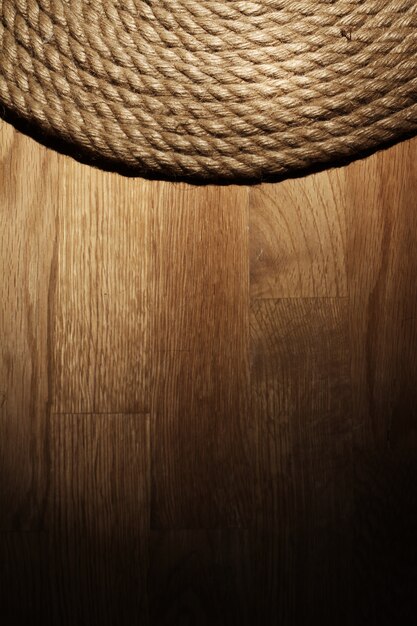 Old rope over wooden surface