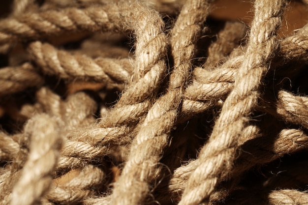 Old rope over wooden surface