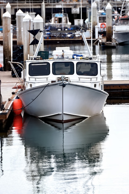 An old rusty boat in an industrial port