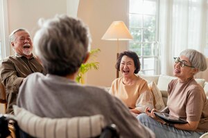 old senior asian friends retired people hapiness positive laugh smile conversation together at living room at nursing home seniors participating in group activities in adult daycare center