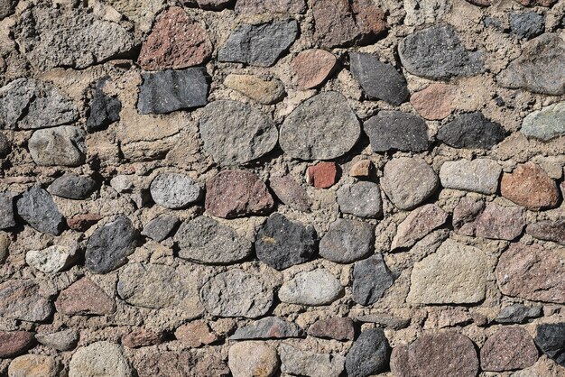 生石の背景とスクリーンセーバーのアイデアで作られた古い石の壁