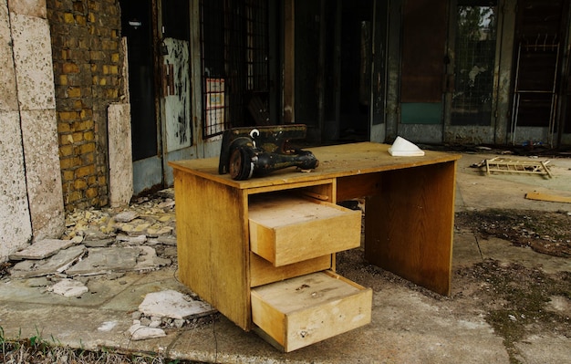 Old table with sewing machine at Chernobyl ghost town Ukraine