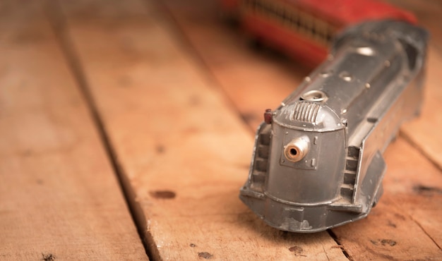 Old toy train on wooden table