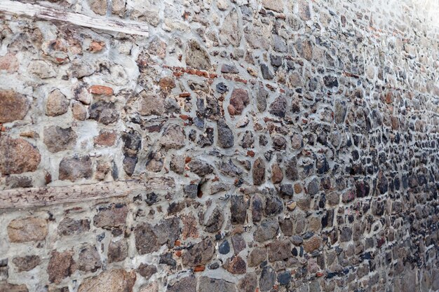 Старая винтажная каменная стена в перспективе