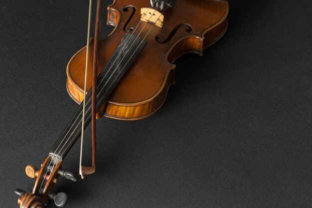 Old violin on a black background