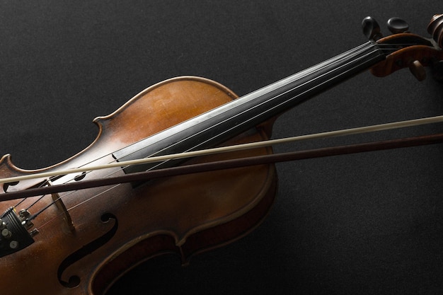 Free photo old violin on a black background