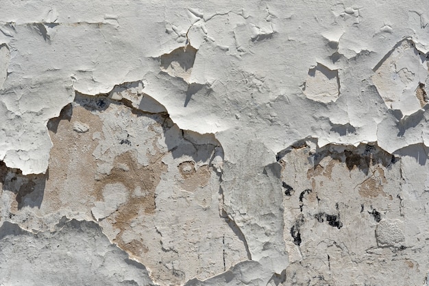 Old wall with falling paint