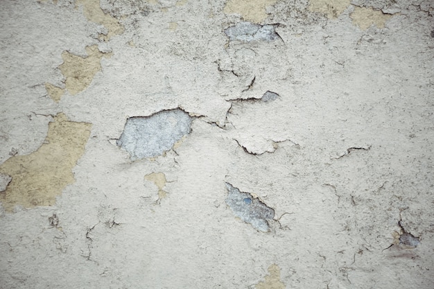 Old wall with peeled plaster background