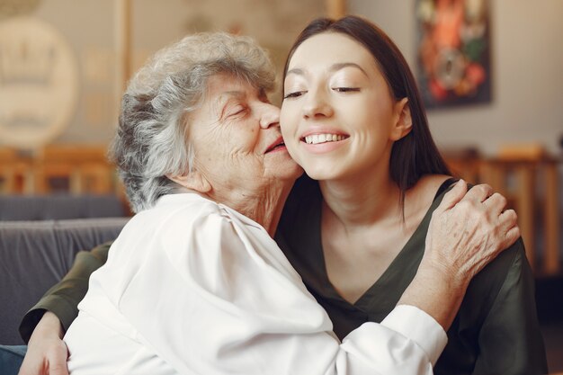 Old woman in a cafe with young granddaughter