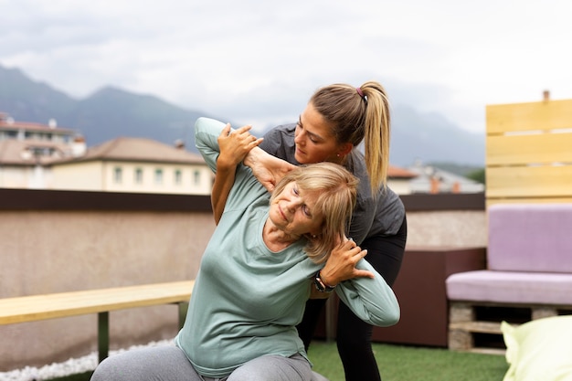 Old woman doing fitness exercises