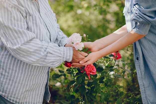 Old woman in a garden with young granddaughter