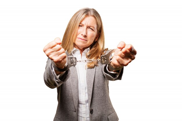 Old woman handcuffed in both hands