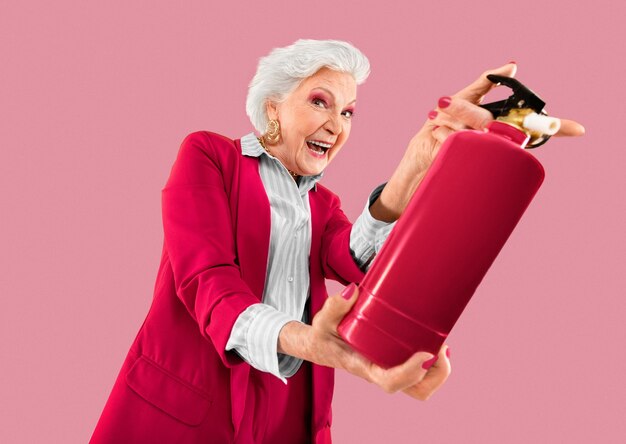 Old woman holding extinguisher color of the year 2023