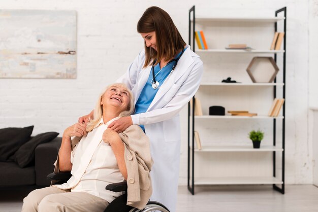 Old woman looking at caregiver