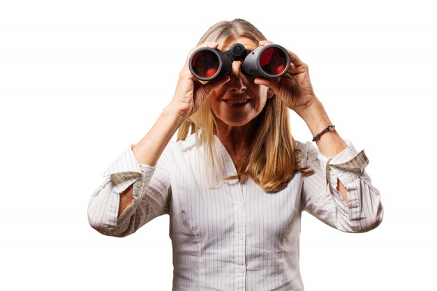 Old woman looking through binoculars