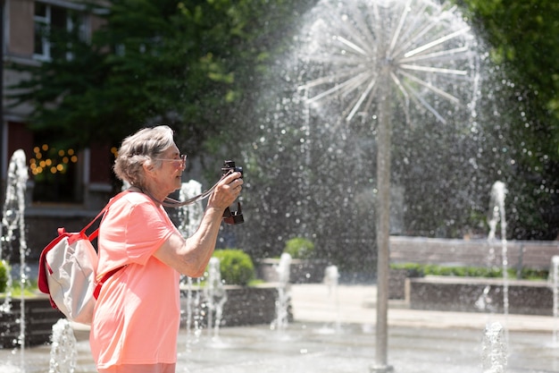 Old woman traveling alone in the summer