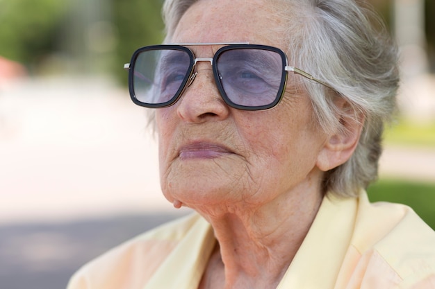 Old woman traveling alone in the summertime