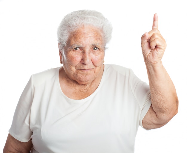 Old woman with a raised finger