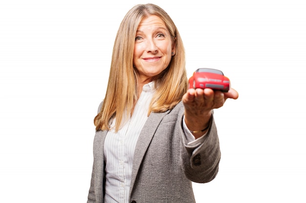 Old woman with a red car