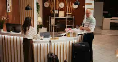 Free photo older couple ringing service bell