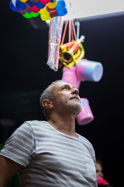 Older man looking at toy kiosk