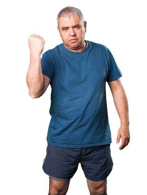 Older man with a raised fist